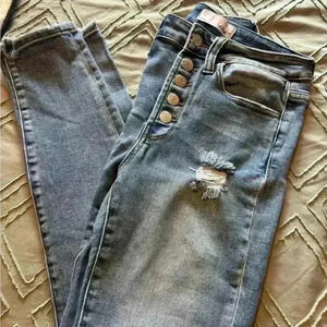 Distressed button fly jeans